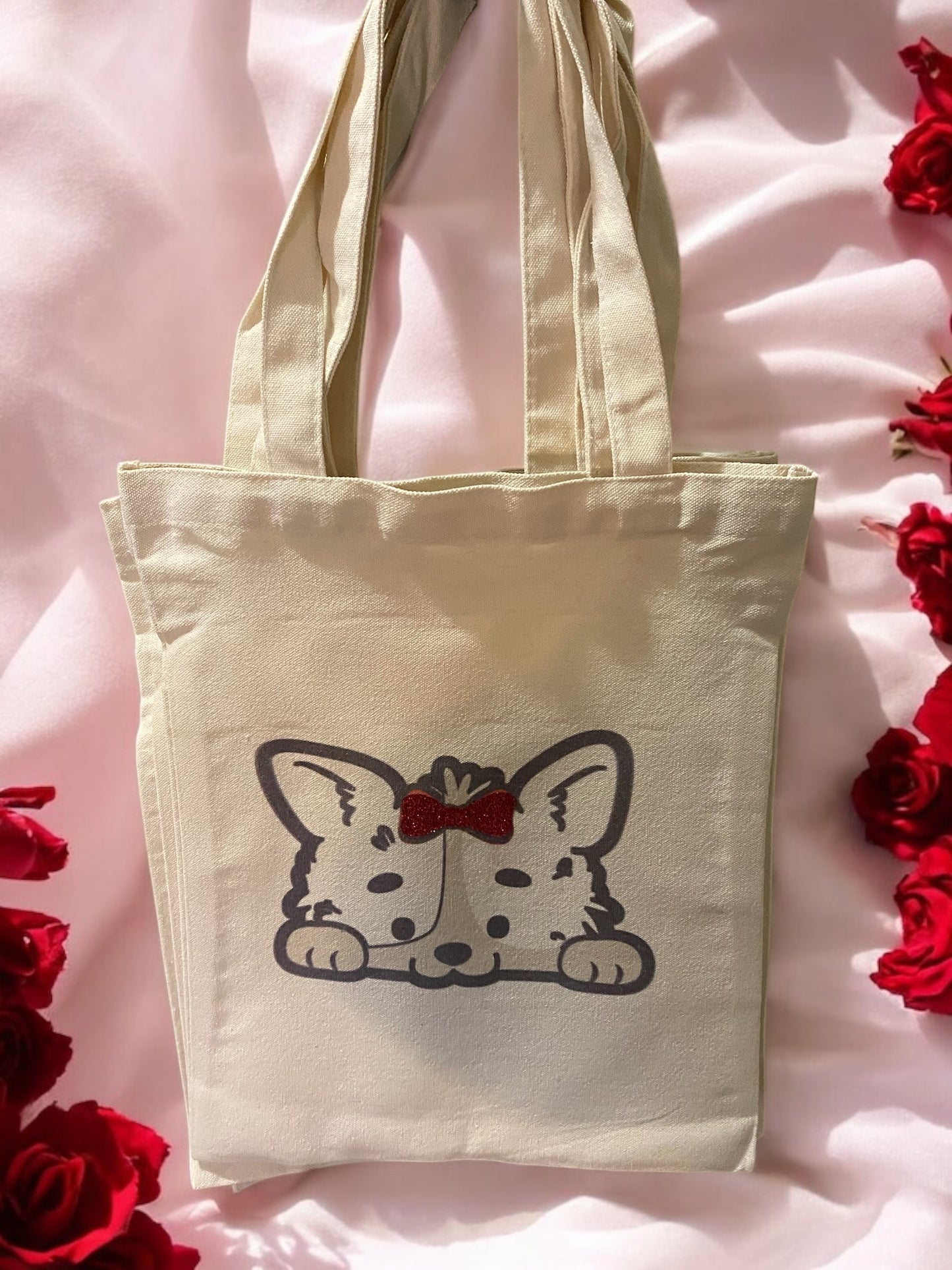 Cute dog tote bag with front and back detail and glitter bow.