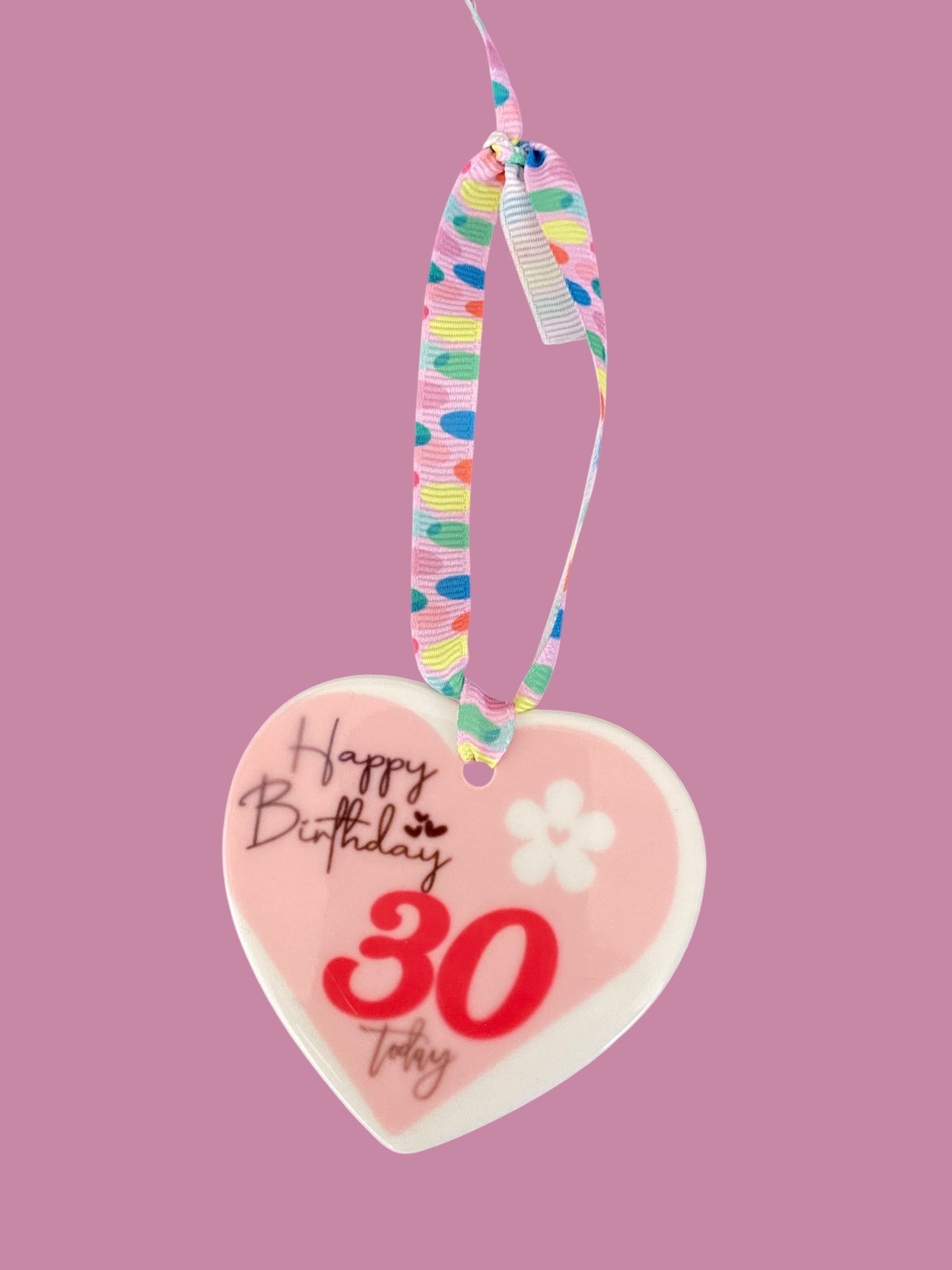 Hand decorated ceramic heart ornament featuring cute galaxy paw print, pet memorial or gift, keepsake with colourful cosmic design